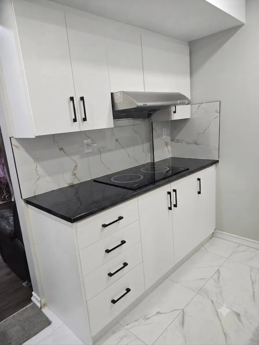 White kitchen cabinets and walls after interior painting